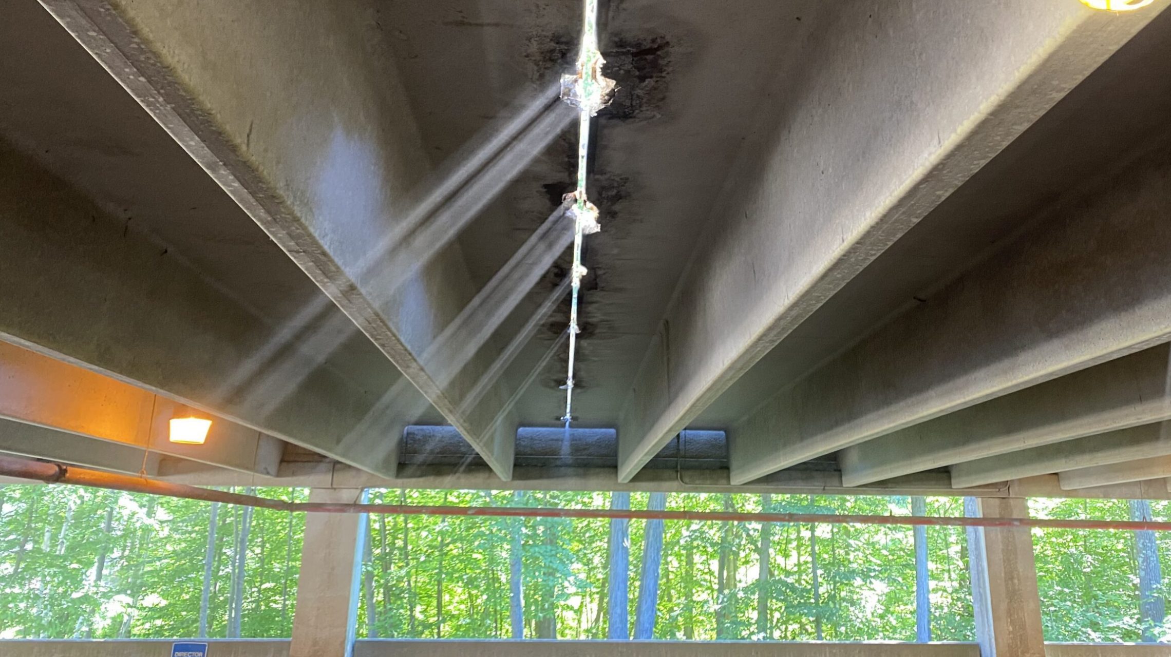 Daylight shines through an open flange-to-flange joint during a connection repair project.