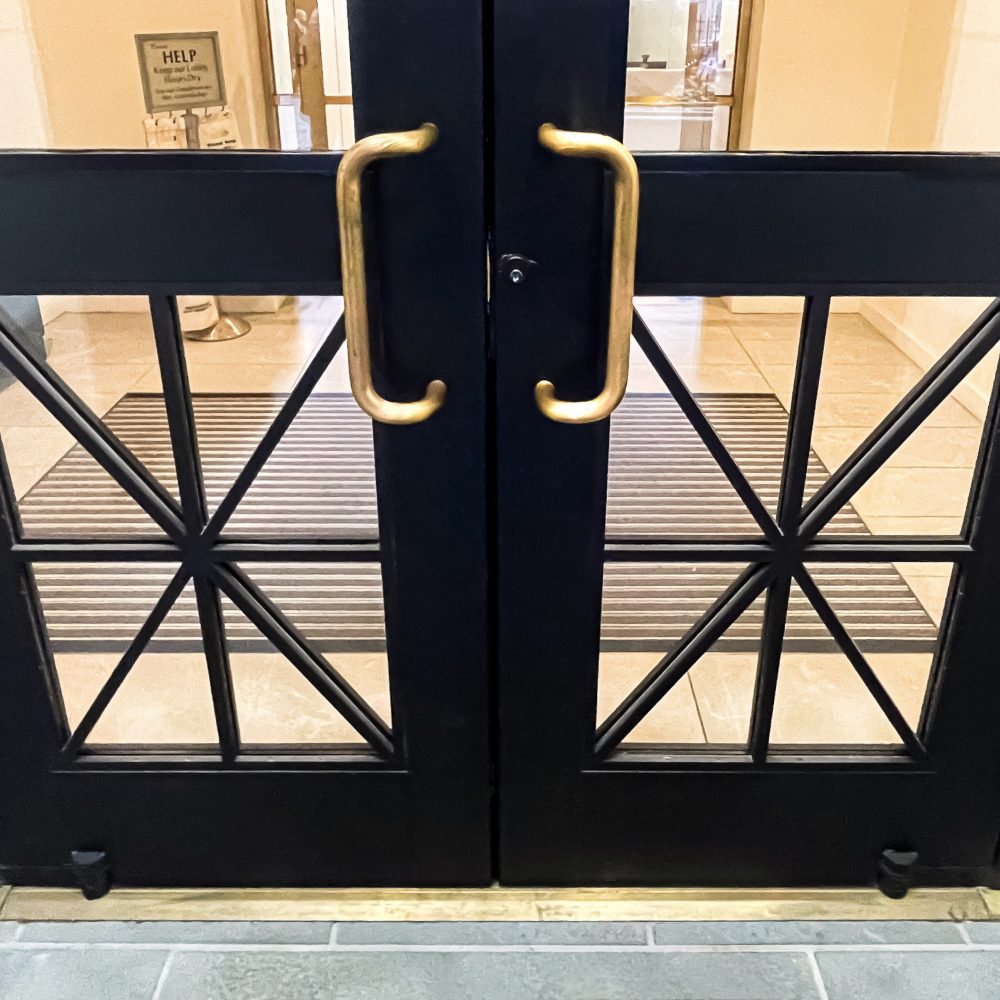 Brass hardware and x-motif detail at New York Stock Exchange door