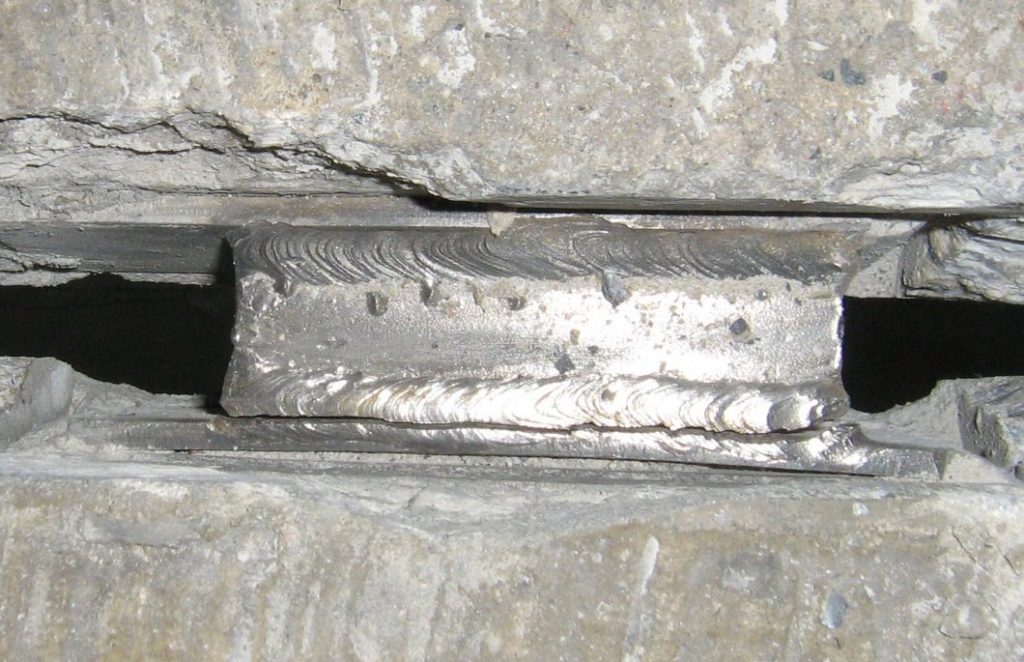 Fractured flange connection caused by cyclical fatigue stress.